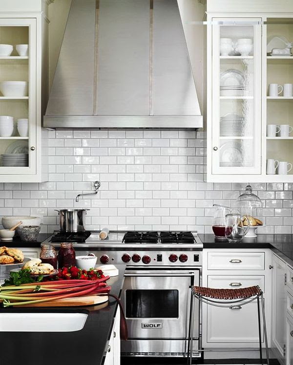 Stainless steel appliances are a simple way of making a white kitchen stand out