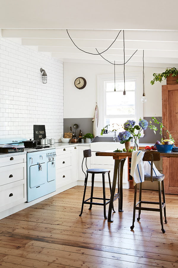 The wooden floor and the light blue accent bring out the rustic beauty