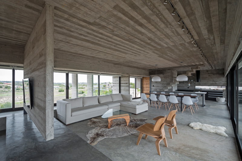 exposed concrete modern house living dining space