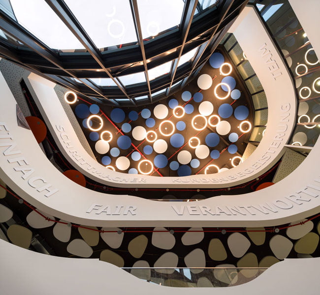 Central atrium with ceiling design of team bank’s new German HQ,