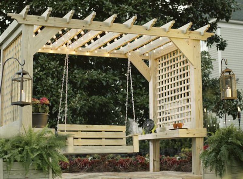 garden wooden pergola with swing in it