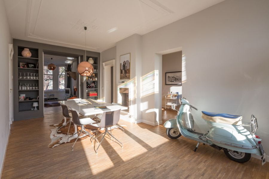 penthouse living dining area devided by creative wall