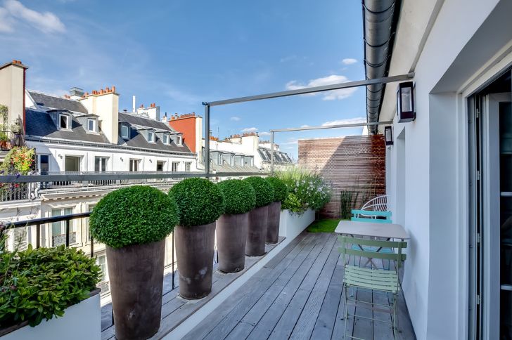 Outdoor balcony deck wooden flooring with planters decor