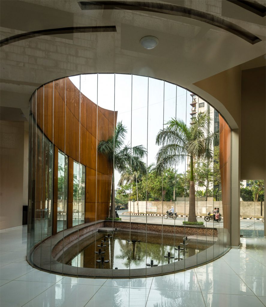 Visitors and staff enter a reception area at one end of the crescent