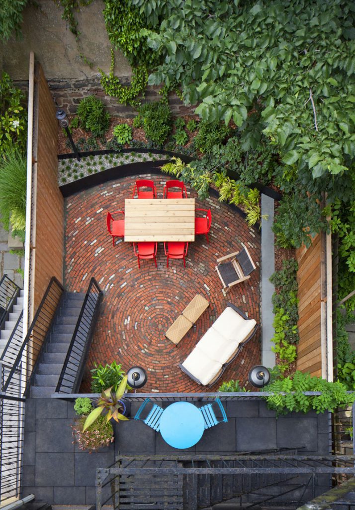 bright colors furniture and circular brick pattern in back patio