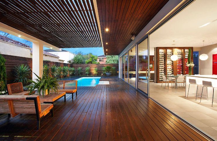 outdoor pool deck wooden flooring and semi covered patio