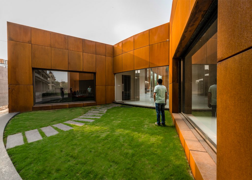 steping stone pathway in green lawn of courtyard