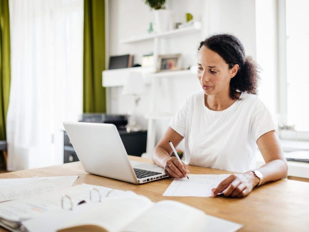 woman taking notes,