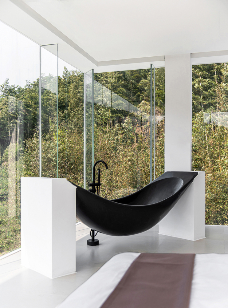 black bathtub, white ceiling, full glass window, bathroom photo, interior photography,