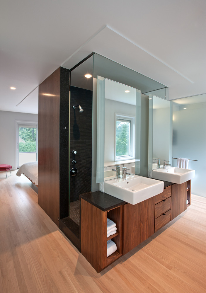 bath room photo, white counter basin, wooden cabinet in bathroom, shower encloser, shower cabin, open floor plan,